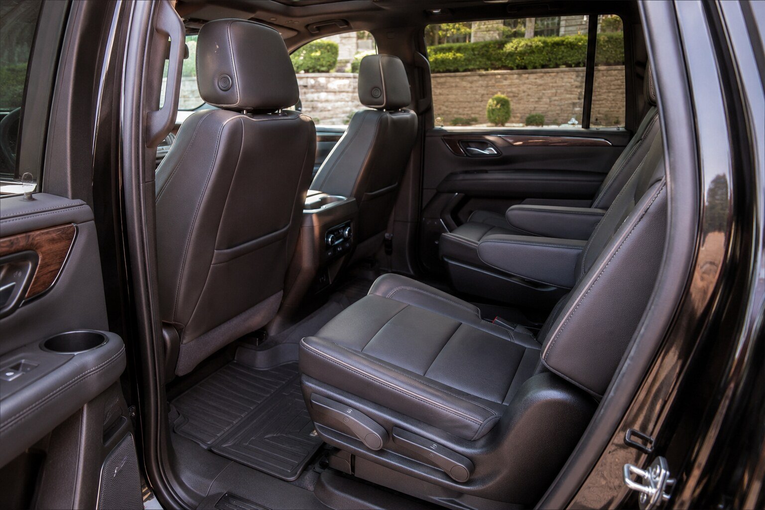 The rear passenger cabin of a black full-size luxury SUV