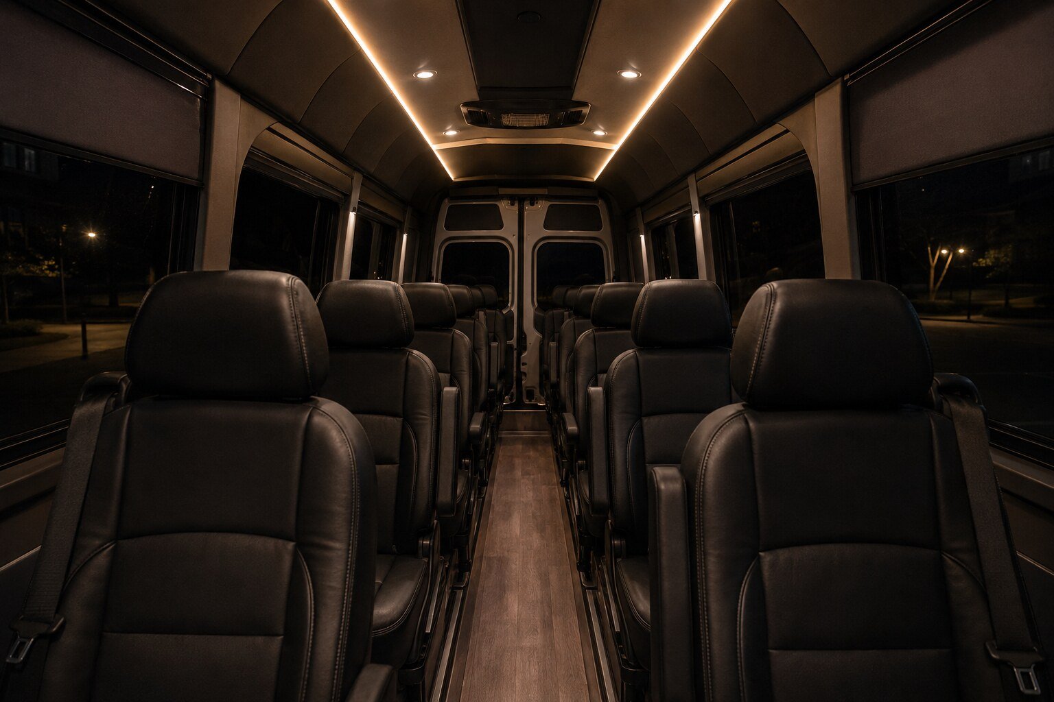 An executive Sprinter cabin lit by warm ambient lighting at night