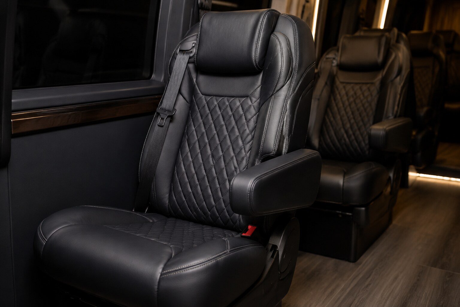 Close view of executive Sprinter seating, stitching and armrest